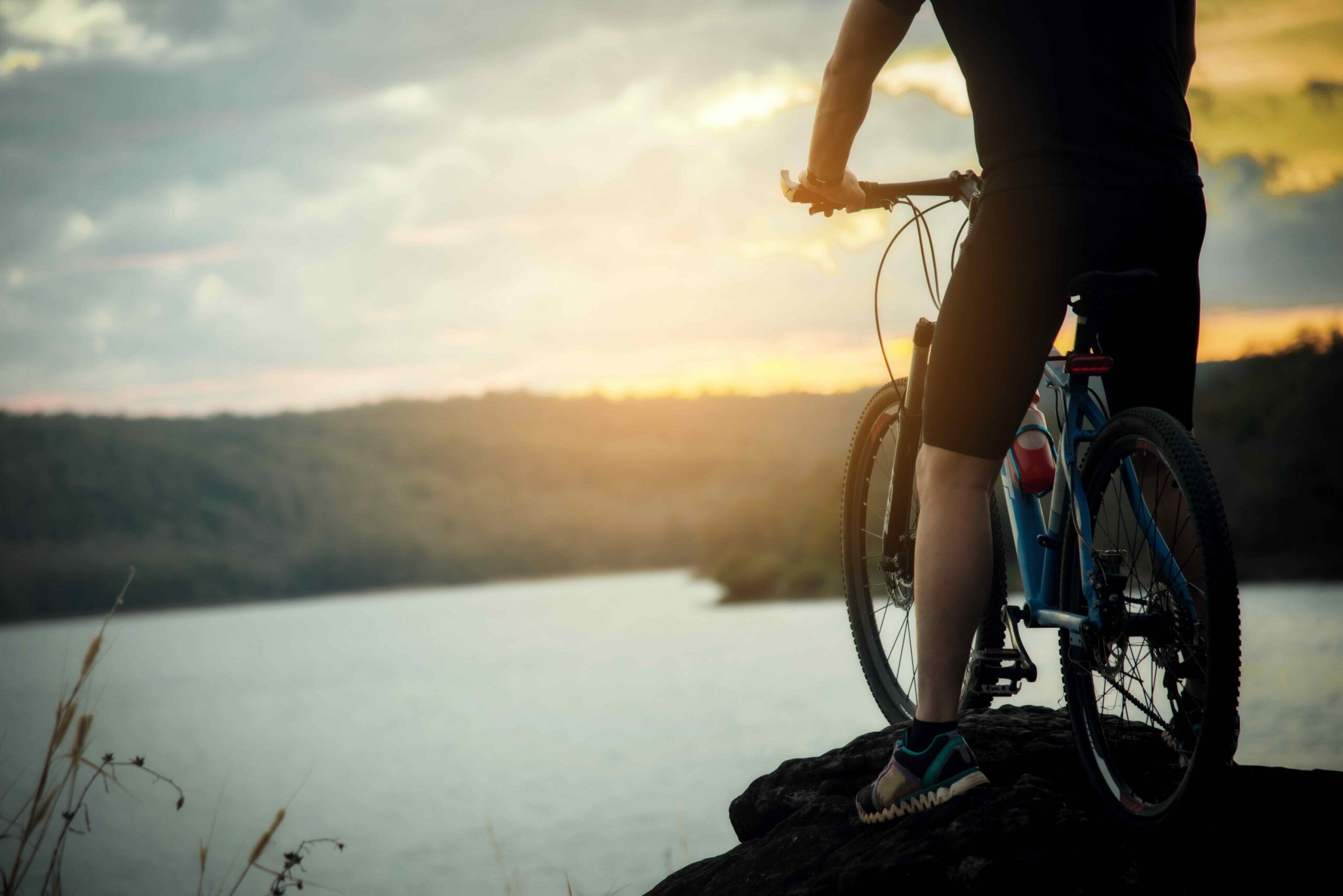 Cyclist Man Racing Bike on Mountain
